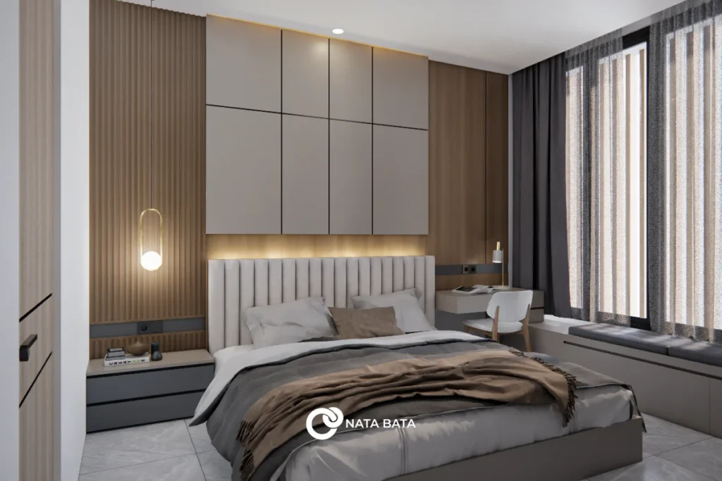 Interior kamar tidur modern minimalis dengan headboard vertikal, panel kayu hangat, pencahayaan ambient, dan meja kerja compact.
